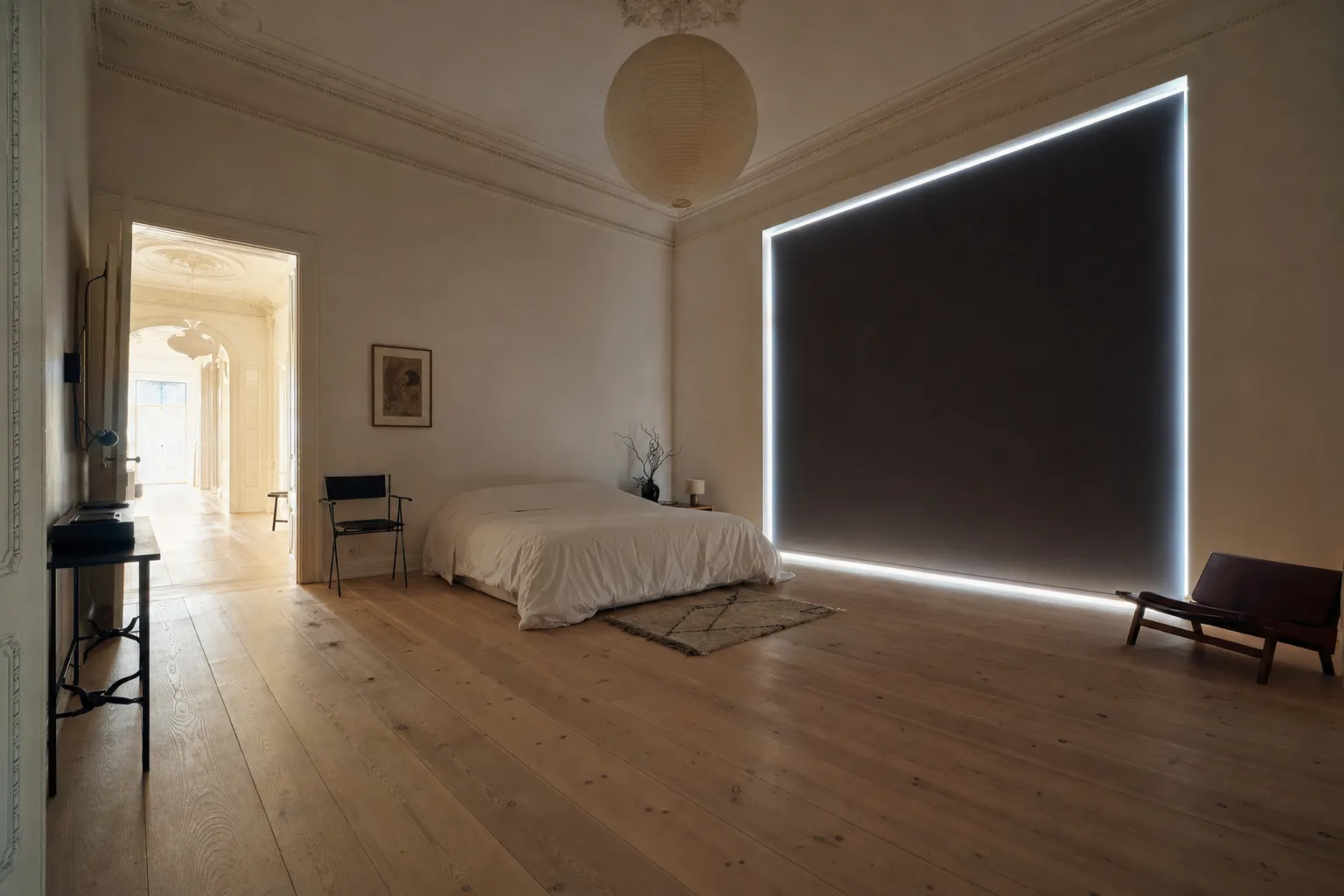 A bright bedroom in the afternoon with a blackout roller fully lowered over the window, the room calm and dim while a hard line of daylight escapes around all four edges of the blind
